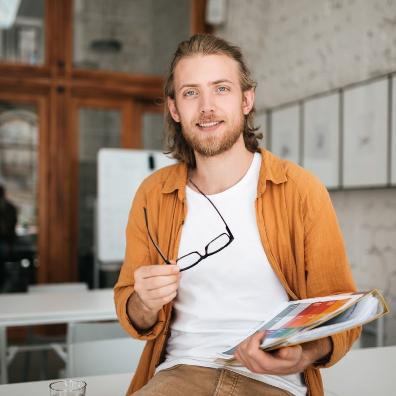 smiling-boy-with-blond-hair-and-beard-joyfully-loo-5USXMTR.jpg